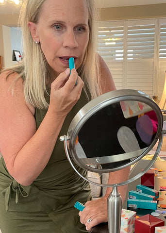 Melissa wears lip tint in shade Melissa